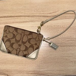 Coach wristlet in good condition! Gently worn hardware.